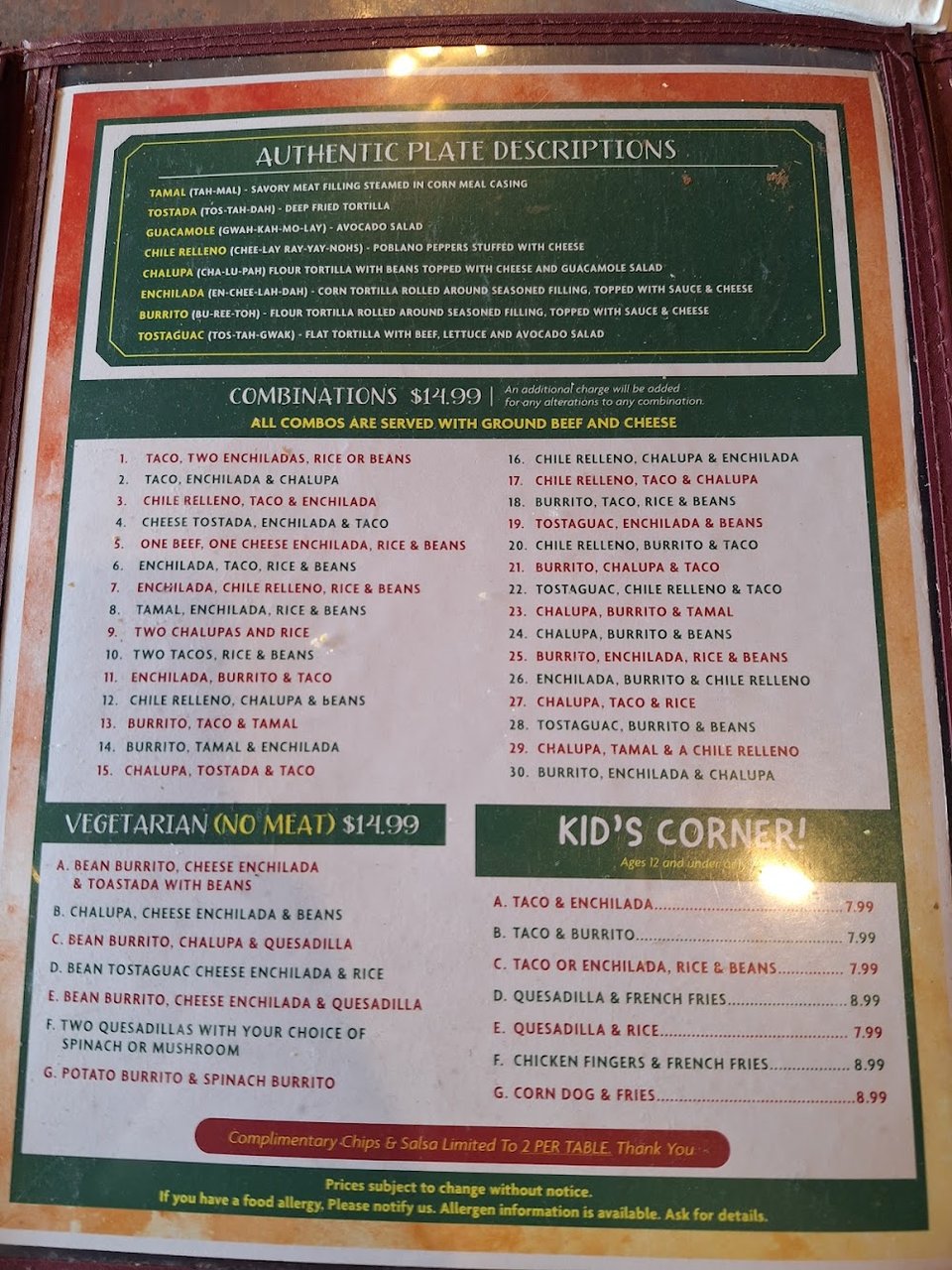Printed menu with vegetarian dishes and tacos.