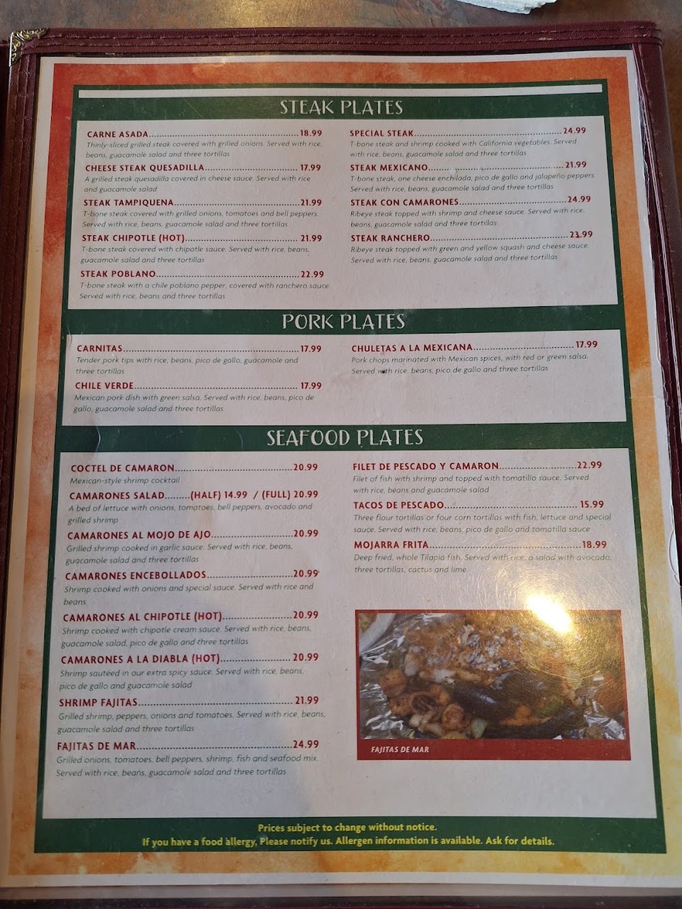 Menu board with Mexican favorites and dinner plates.